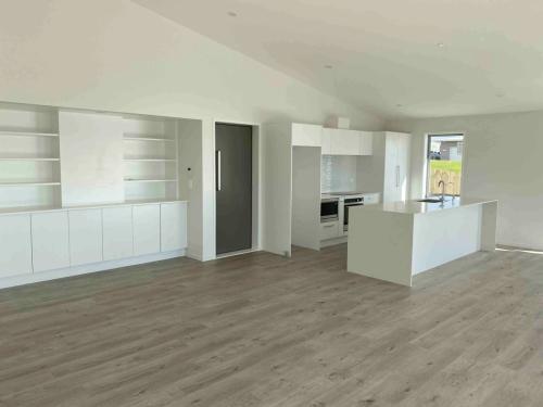 Raking ceiling Spacious open plan kitchen, dining & living